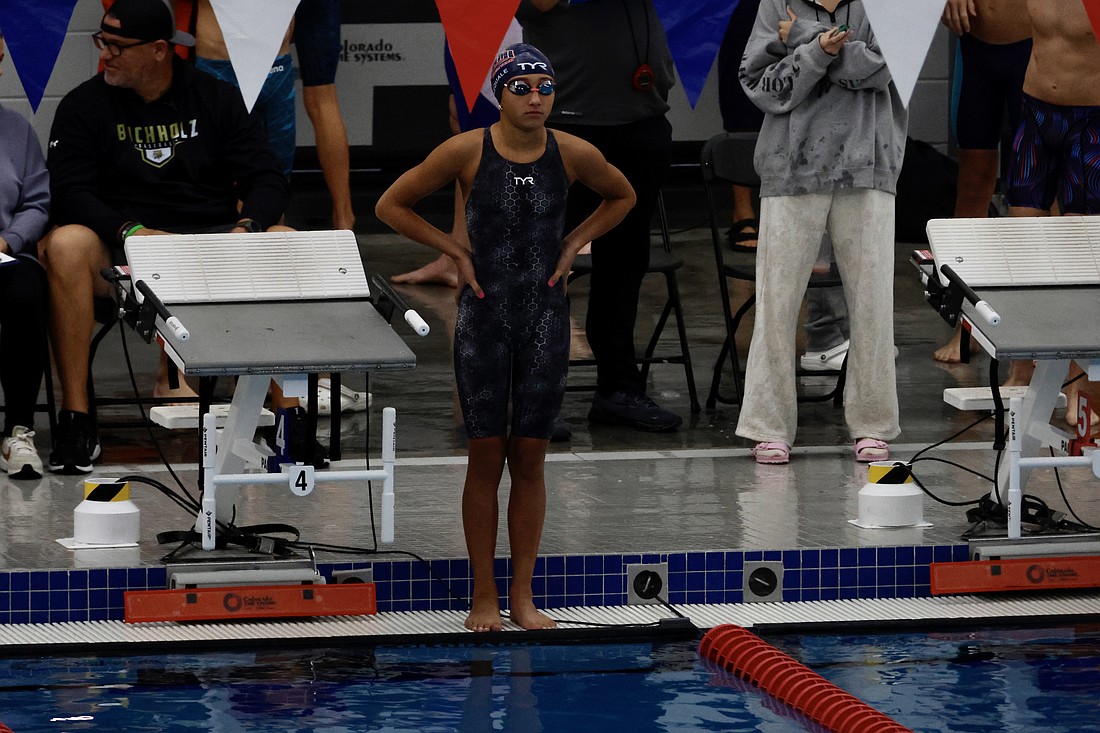 Sarasota Tsunami swimmer Ava DiPasquale steadies herself before competing in the 2024 Gator Holiday Classic Dec. 6-8 in Ocala. DiPasquale, who turned 13 in December, broke Florida Swimming records in the 100-yard and 200-yard individual medley.