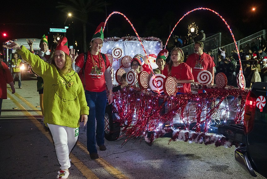 Pine Trail Elementary shows off a candy-filled float and elven walkers in the 33rd annual Home for the Holidays parade. Photo by Michele Meyers Pine Trail Elementary shows off a candy-filled float and elven walkers in the 33rd annual Home for the Holidays parade. Photo by Michele Meyers