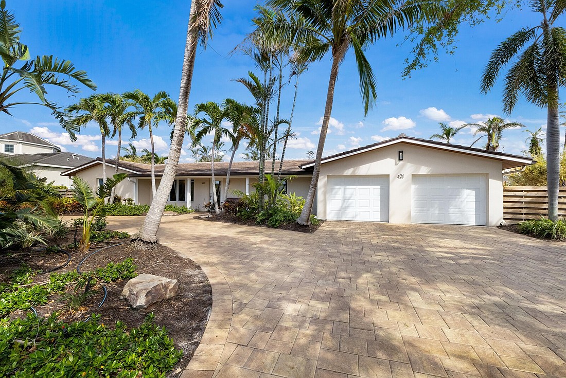 The home at 421 Wood Duck Drive has three bedrooms, three-and-a-half baths, a pool and 2,052 square feet of living area.