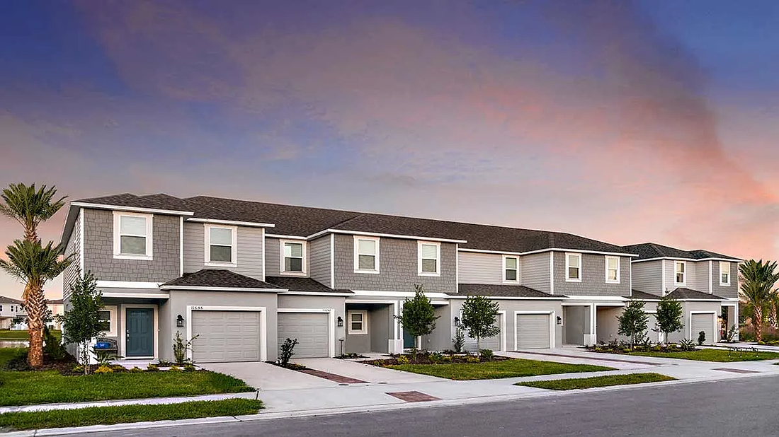 A row of townhomes in the Taylor Morrison built community Edgestone at Artisan Lakes in Palmetto, Florida.