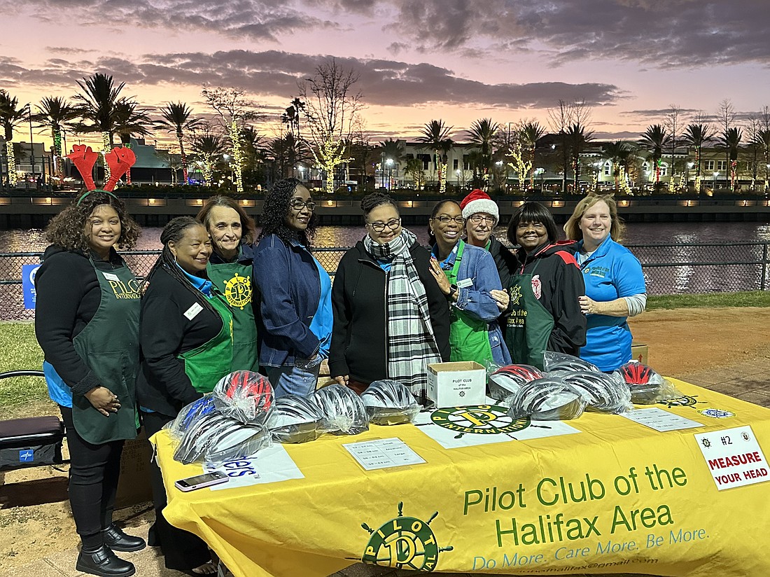 Pilot Club of the Halifax Area members recently helped fit helmets to Daytona Beach children. Courtesy photo