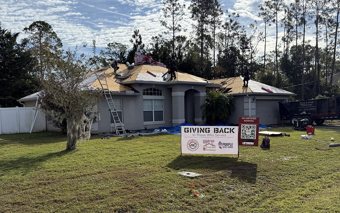 Janie Holley received a new roof on Dec. 9 through the Owens Corning Roof Deployment Project, a nationwide program that helps support military families. Photo courtesy of the Owens Corning Roof Deployment Project