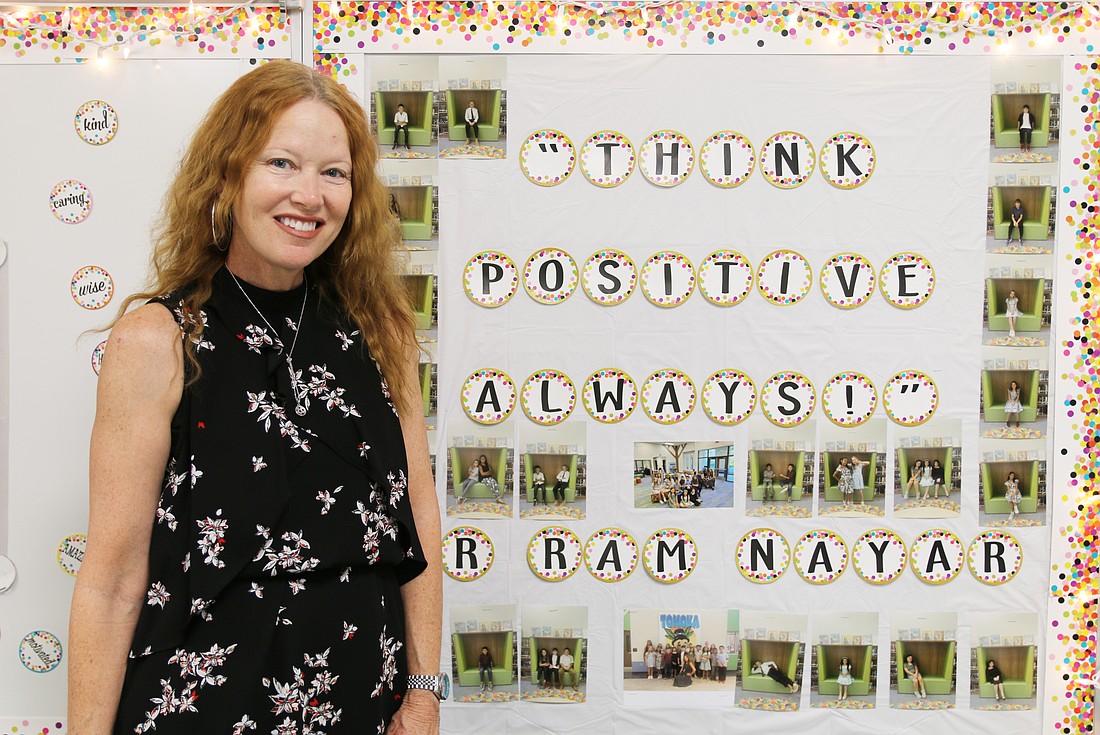 Kelli Chehaitli has her college professor's words up on her classroom wall: Think positive always. Photo by Jarleene Almenas