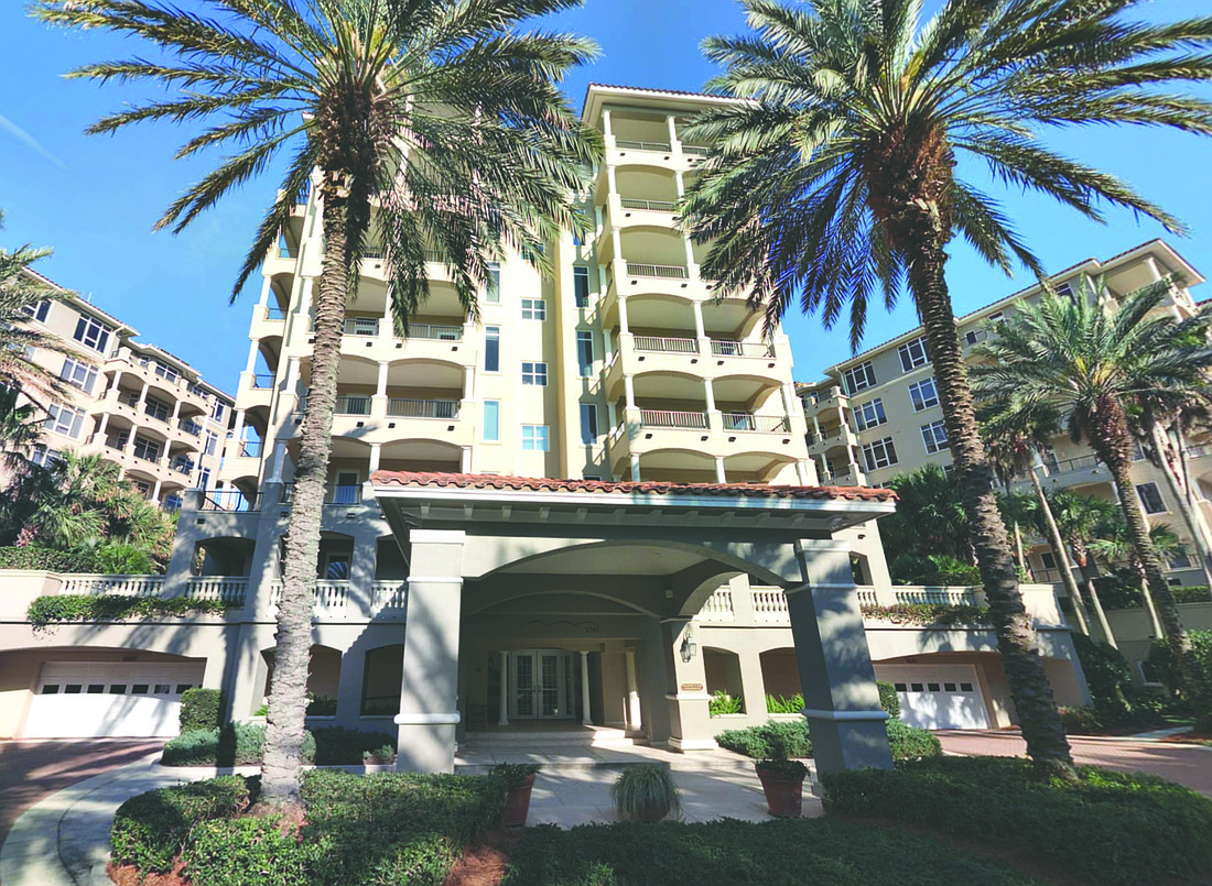 Oceanfront condominium features three bedrooms, four bathrooms, porch, two-car garage and community pool.