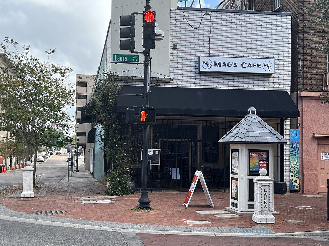 The Mag's Cafe building at 231 N. Laura St. and an adjacent building at 38-44 W. Monroe St. sold  Dec. 19 for $1.4 million.