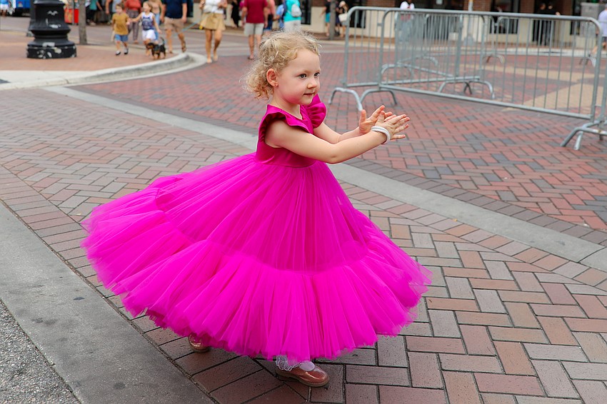 4-year-old Evelyn Duchenko is excited for the overhead pineapple to drop at midnight.