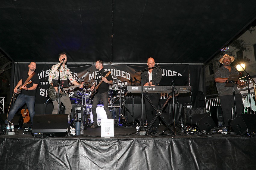 The Daniel B Marshall band plays on the west end of Main Street during the New Year's Eve Pineapple Drop celebration in Sarasota.