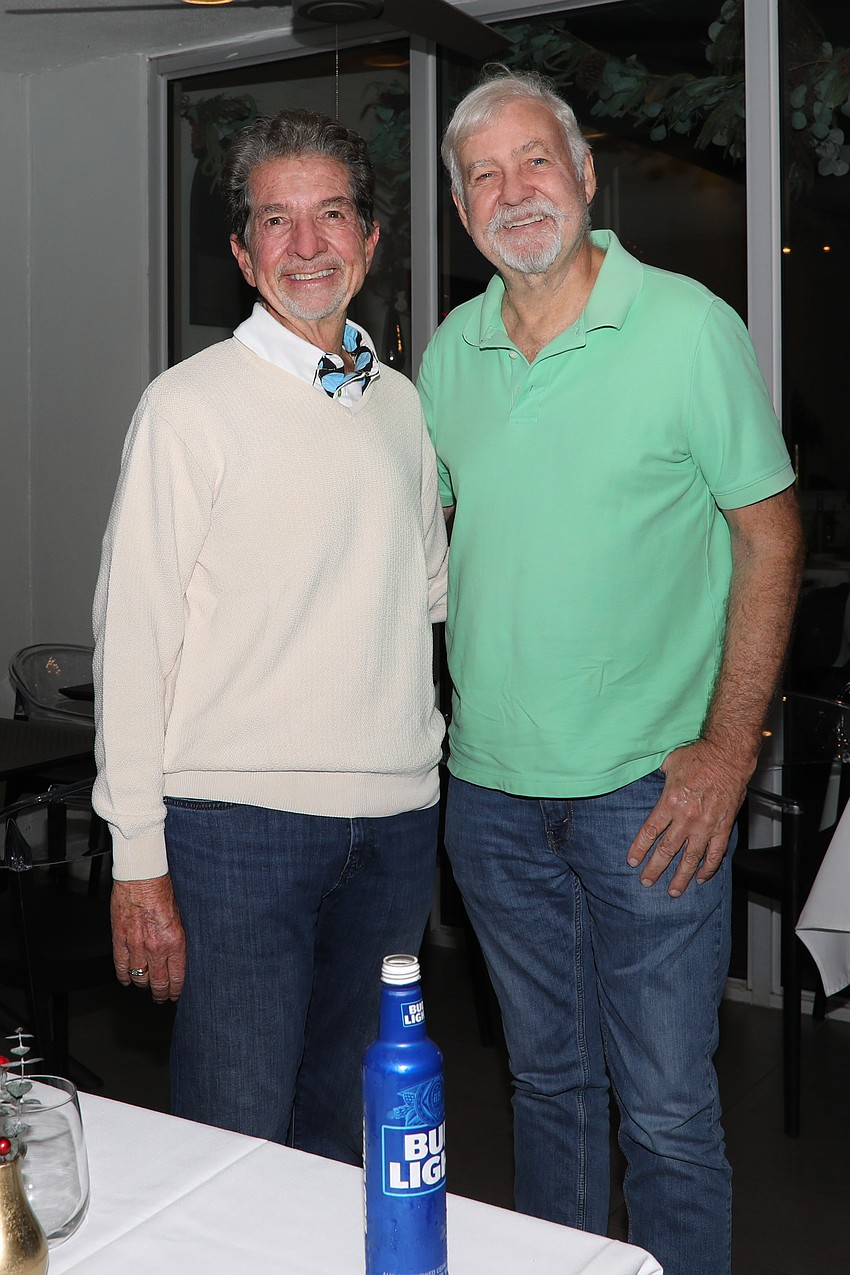 Bob Bunting and Jon Hausburg celebrate at the Downtown Sarasota NYE Pineapple Drop celebration on Dec. 31.