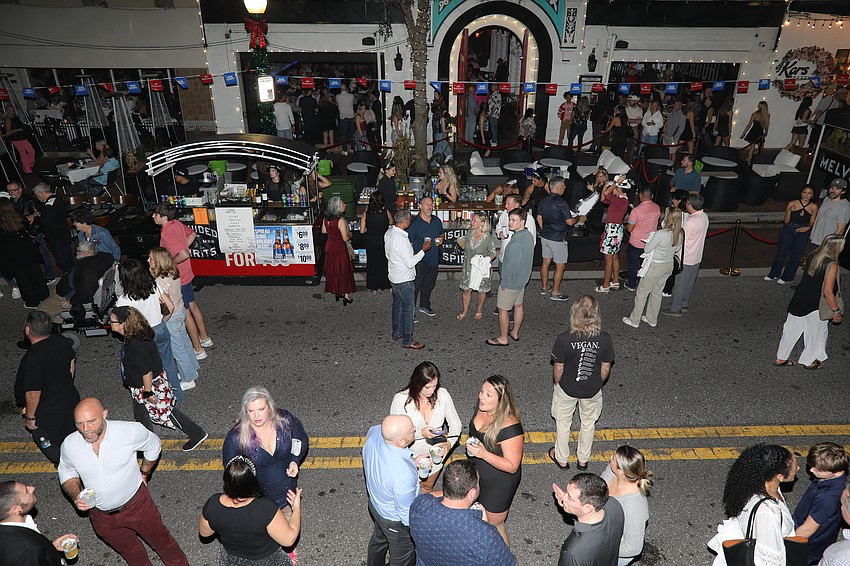 From the vantage point of the El Melvin Cocina Mexicana VIP bar held above Sarasota's Main Street revelers down below enjoy the New Year's Eve street party.