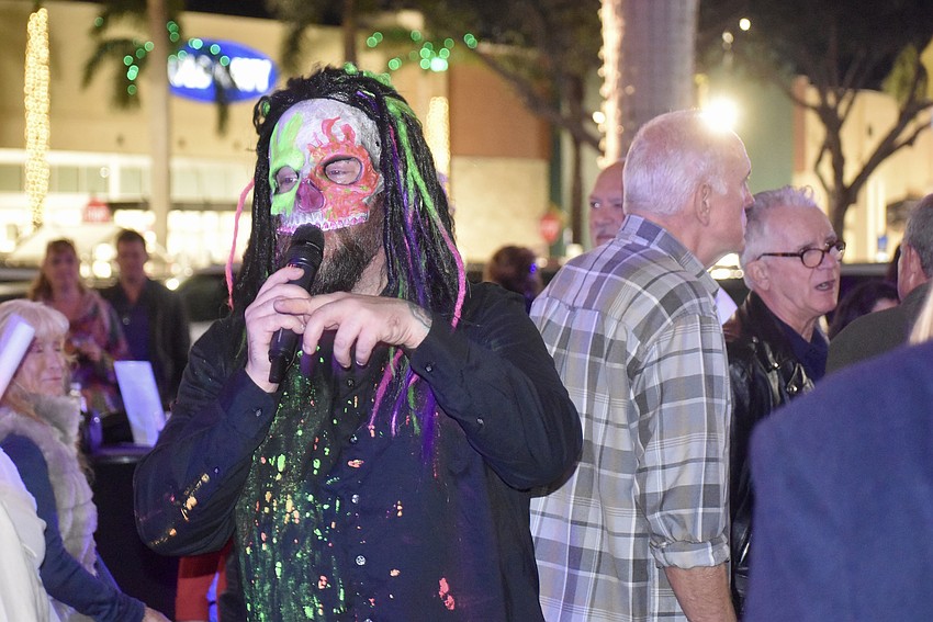 Johnny Bonez steps off stage and into the crowd to perform 