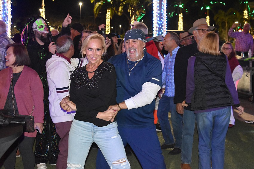 Sarasota's Johnny Luciano spins Laura Harper on the dance floor.