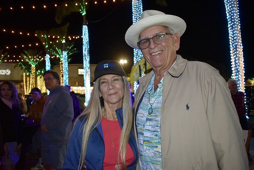 Bradenton's Jody Reynolds and Sarasota's John Burgstiner take a quick break from dancing.