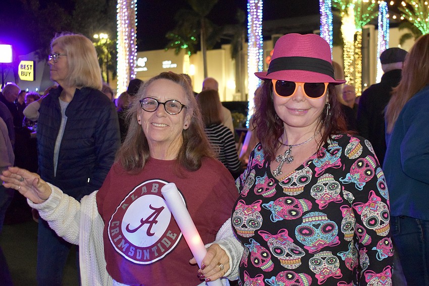 Bradenton's Sonia Wolfe and Sun City's Shelley Hughes dance in front of the stage.
