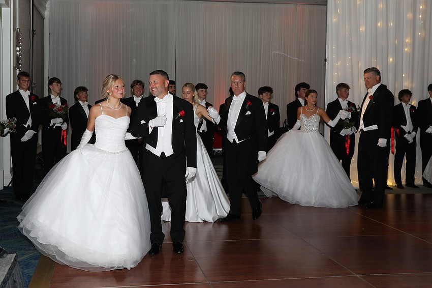 Debutante Rylie Jackson is presented by her dad, Craig.
