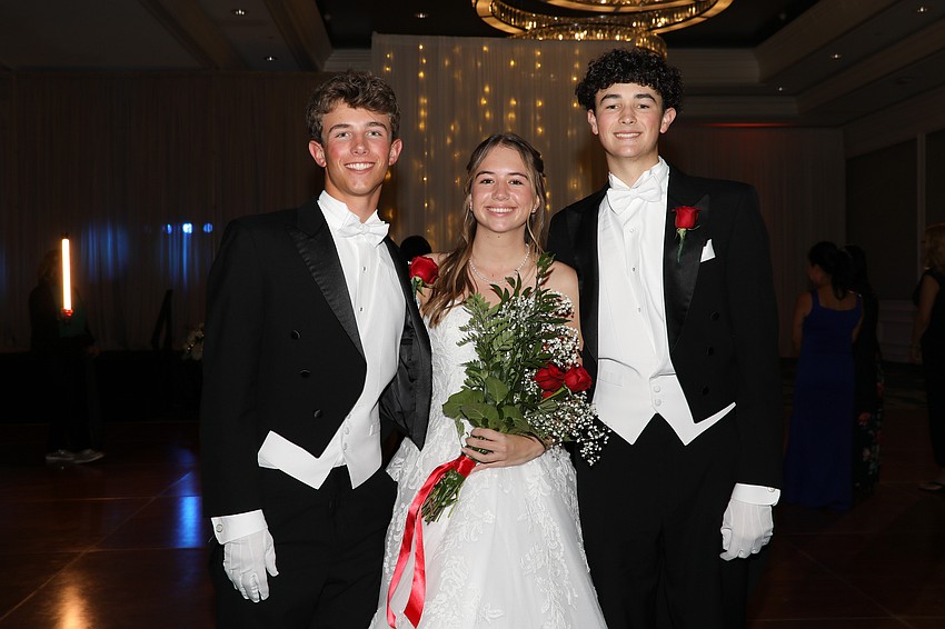 Debutante Regan Hughes with escorts Wyatt Wrigley and Austin Joyner.