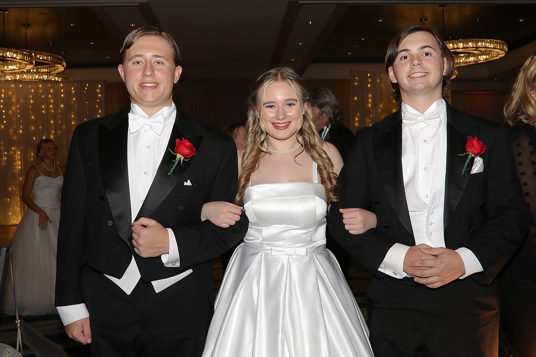 Debutante Callaway Johnson with escorts Noah Johnson and Addison Wiggins.