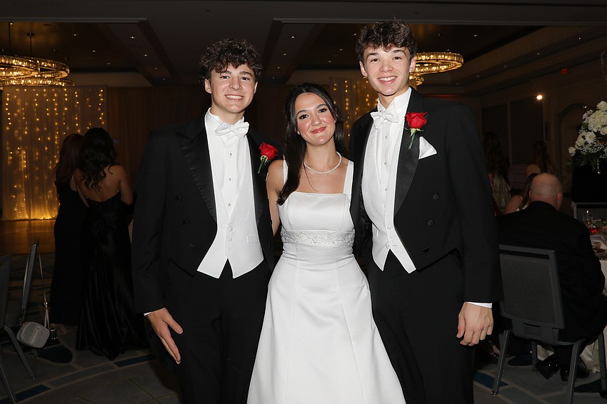 Debutante Sterlingfaith Williams with escorts Steele Williams and Wyatt Wosniak
