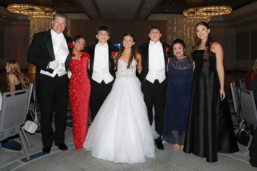 Debutante Camiryn Opstal and escorts Tristyn Opstal and Greg Harris are photographed with her family: Maurice, Sydney, Vanessa and Madisyn Opstal.