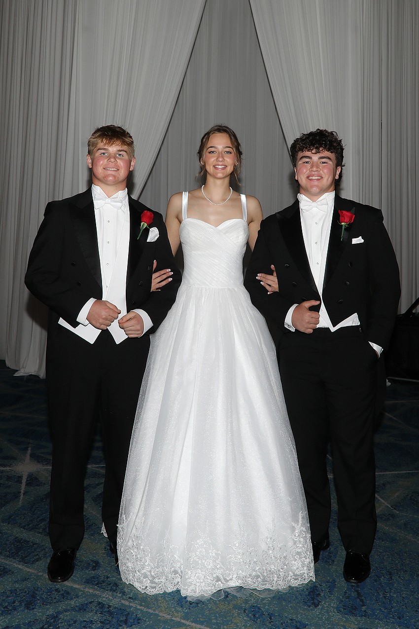 Debutante Annabelle Pullen with escorts Colson Kragt and Jeremy Stroh.
