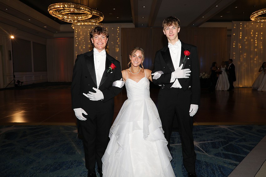 Debutante Loudon Dougherty and her escorts Ethan Perrin and Gabe Owen.
