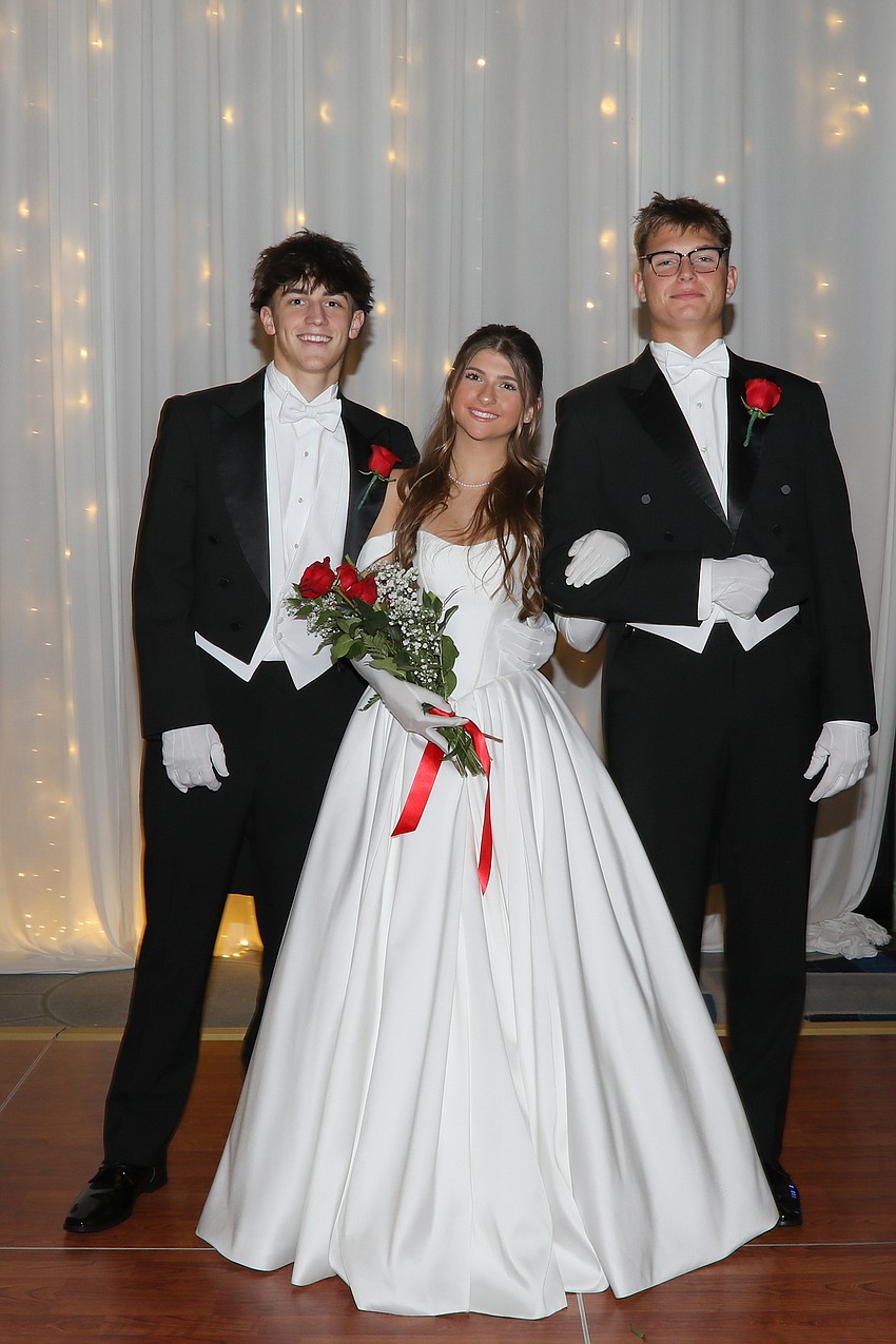 Debutante Lola Delbridge with escorts River Rell and Graham Jaynes.