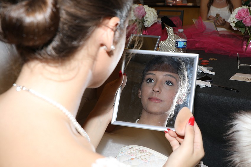 Emma Rigney gets ready for her presentation during the 43rd Debutante Ball.