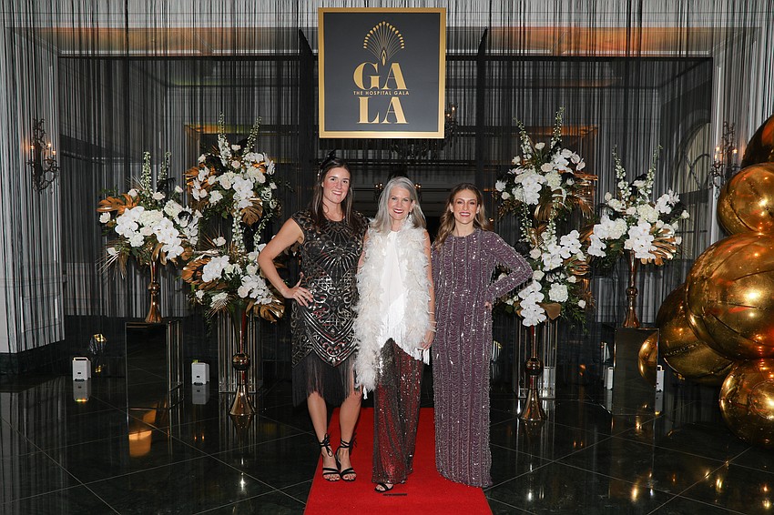 Rachel Williamson, Sally Schule and Rachael Fisk are ready to greet their 625 guests with a speakeasy entrance for the 8th annual Hospital Gala.