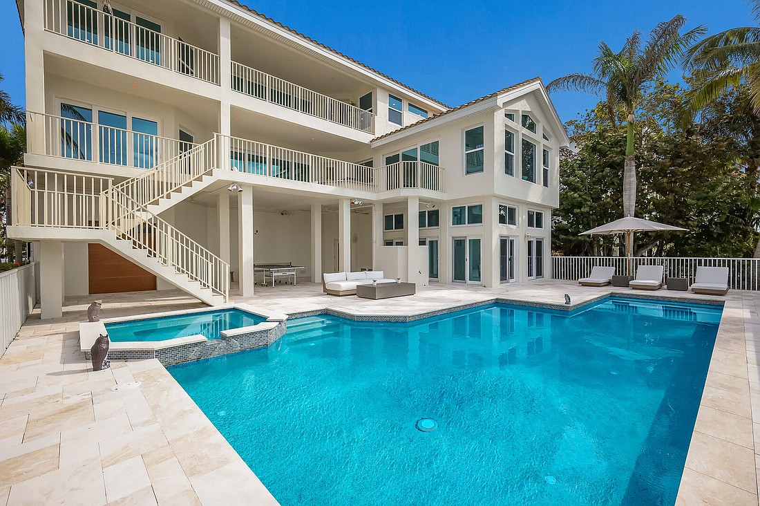 The home at 6877 Gulf of Mexico Drive has four bedrooms, four baths, a pool and 4,820 square feet of living area.