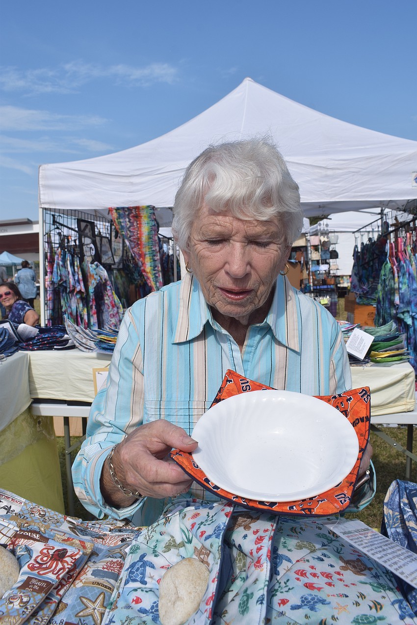 Kay Heigle sells cozies at Market on the Key.