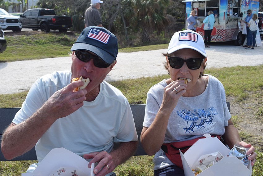 Tom and Marianne Daker eating tacos from the Maine Line Food Truck at the Market on the Key.