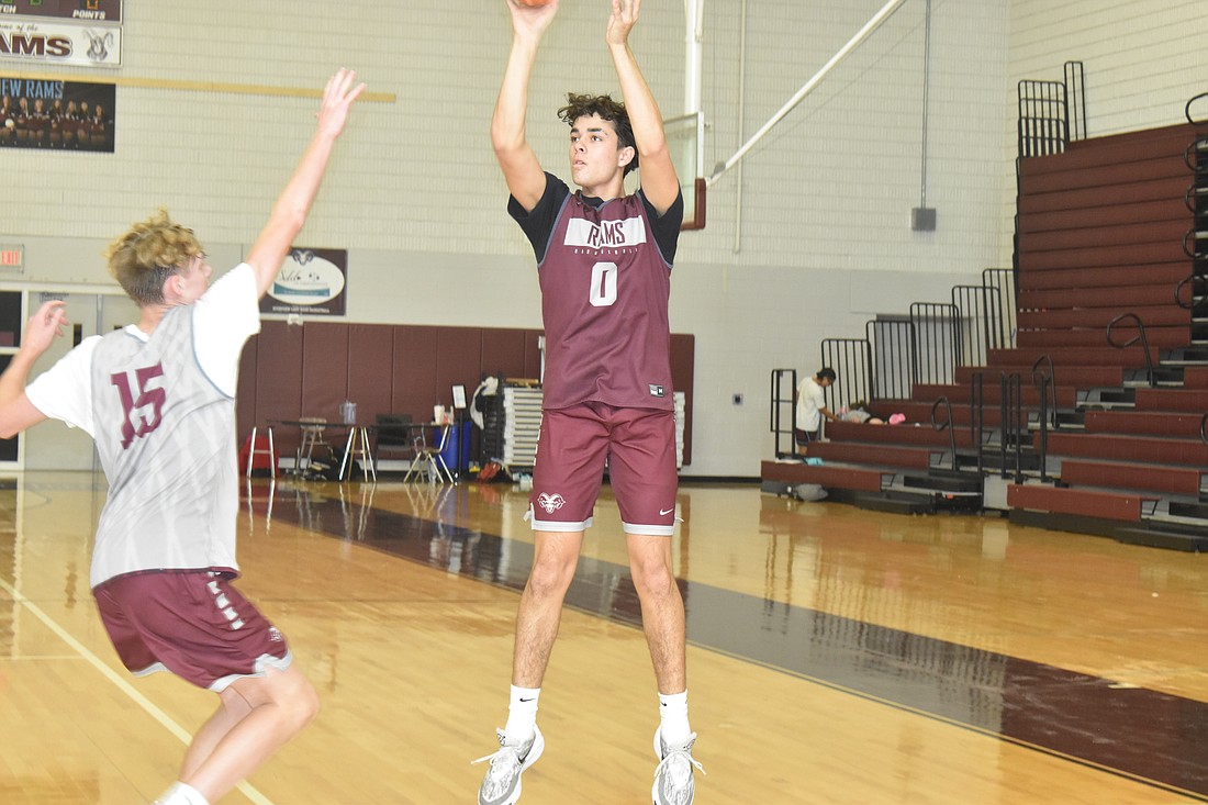 Riverview High junior Josh Harris rises up for a three pointer during practice.