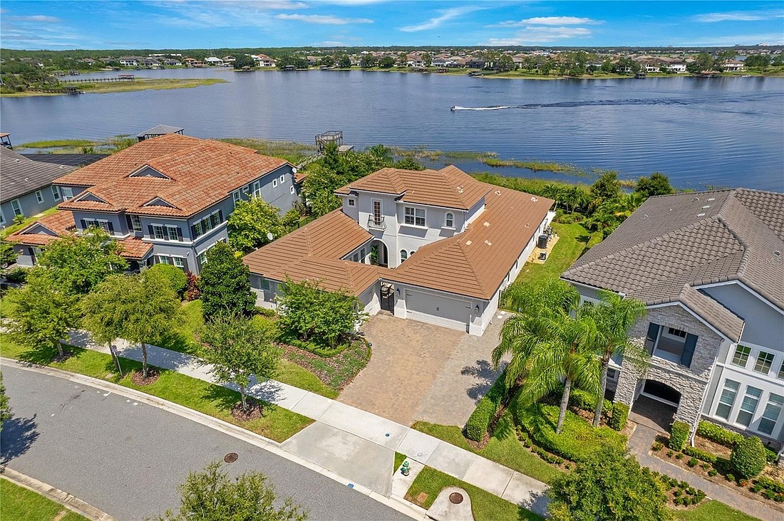 The home at 15144 Shonan Gold Drive, Winter Garden, sold Jan. 3, for $1,850,000. This home features 115 feet of shoreline on Lake Hancock, as well as views of the Disney fireworks. The sellers were represented by Roland Cotardo, The Simon Simaan Group.