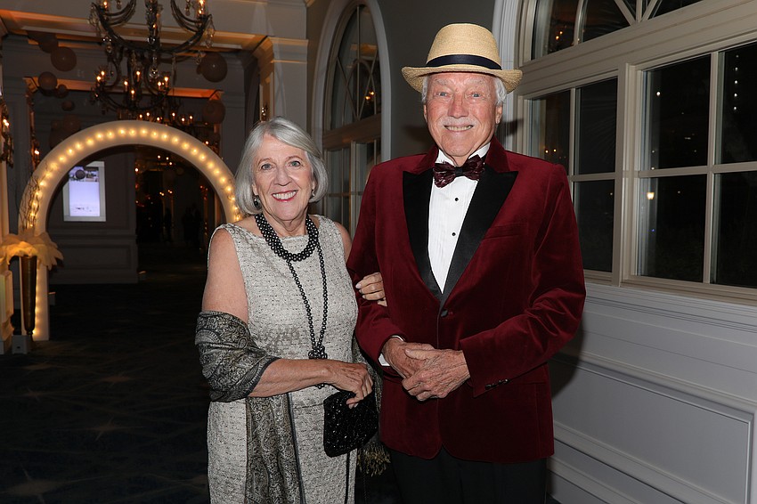 Paula Norwood and Allen McGee enter the speakeasy.