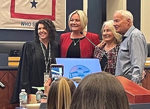 Shelly Edmonson (second from left) after getting sworn in as Flagler County Tax Collector by Flagler County Judge Andrea Totten (left) Edmonson's parents are at right. Courtesy photo