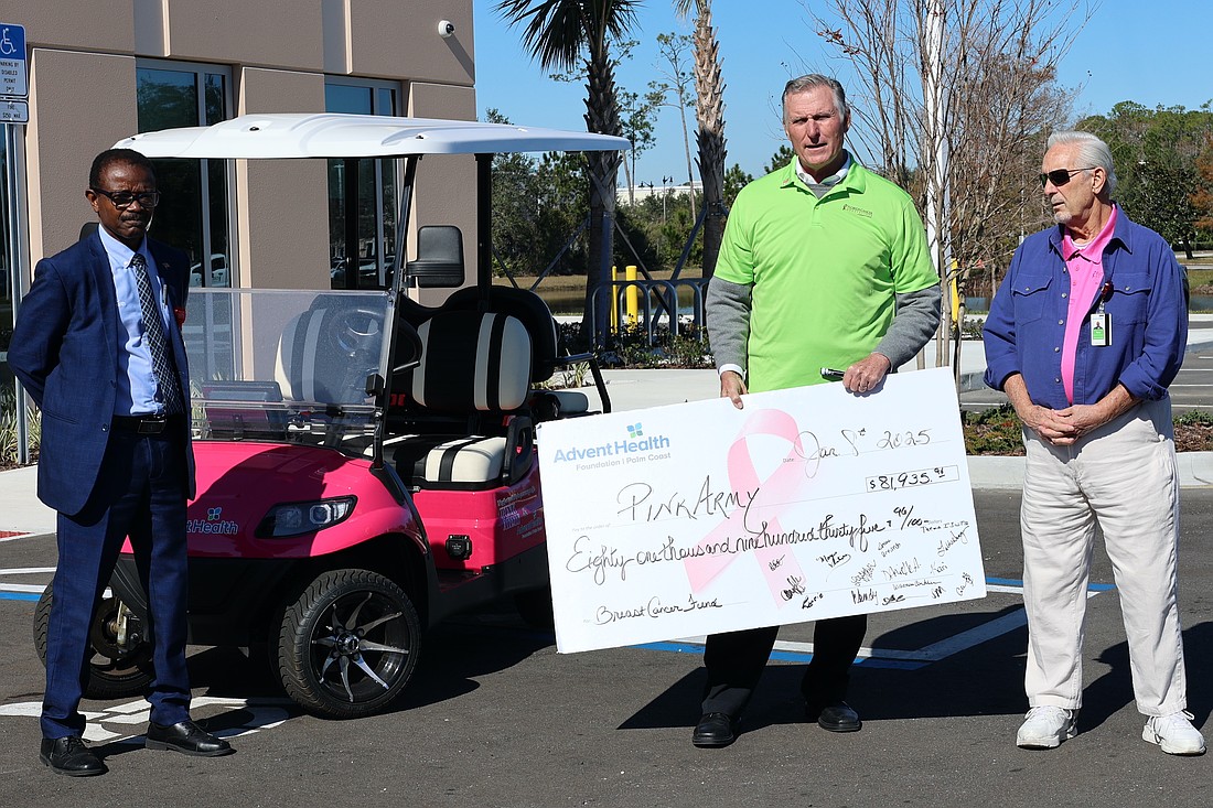 AdventHealth Chaplain Earl Glanville, AdventHealth Palm Coast Foundation Executive Director John Subers and Foundation Board Chairman Tony Papandrea. The Pink Army Committee raised $81,000 partly for the new pink golf cart to help team members travel around the hospital campus. Courtesy photo