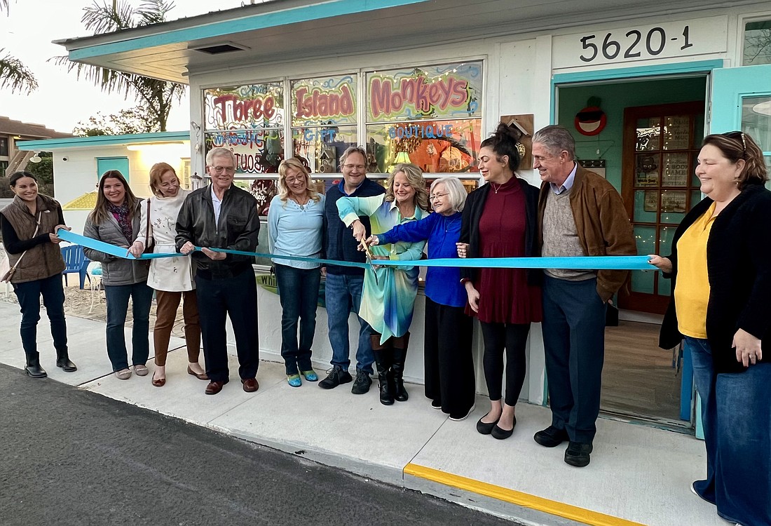 Brigette Kubin cut the ribbon for her business, Three Island Monkeys, on Jan. 8.