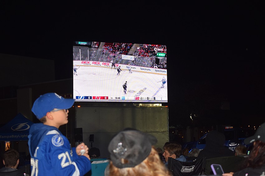 The crowd settles in to watch the Lightning and Devils play for a watch party held in front of Ed's Tavern at Lakewood Ranch Main Street on Saturday, Jan. 11.