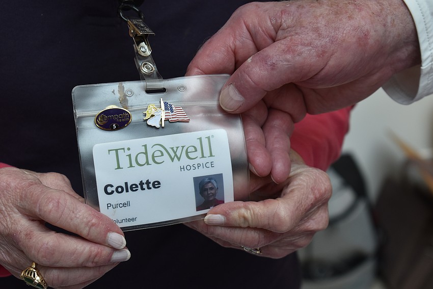 Volunteer Colette Purcell wears the angel pin that's offered to family members of veterans in hospice.