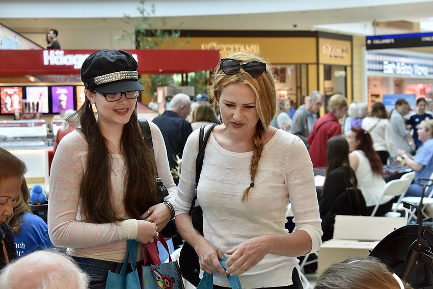 Lakewood Ranch residents Lola Selvach and Amy Curnick check out the LifeLink table. LifeLink is an organ donation program.