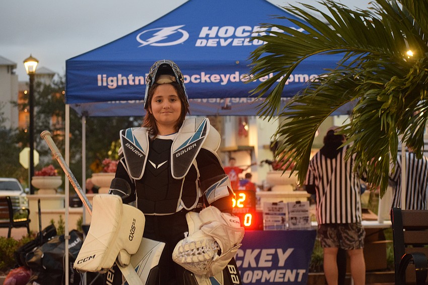Goalie Lucas Chancey takes a break in between ball hockey games during a round-robin tournament for elementary and middle school-aged kids at Lakewood Ranch Main Street on Saturday, Jan. 11.