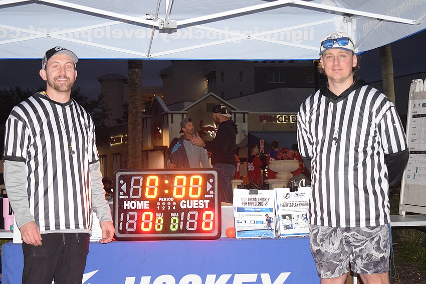 Staff members of Tampa Bay Lightning Community and Hockey Development, including Jordan McKenzie (left) and Joe Adams (right) helped organize the event and provided rink set-up and referees.