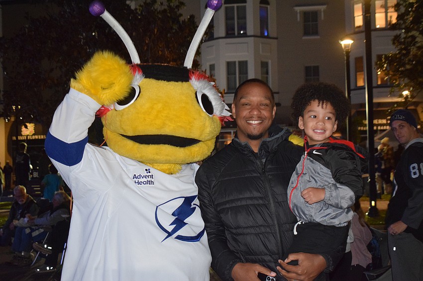 Will and Braylon Kent couldn't pass up getting their photo taken with ThunderBug during the Tampa Bay Lightning watch party in front of Ed's Tavern at Lakewood Ranch Main Street on Saturday, Jan. 11.