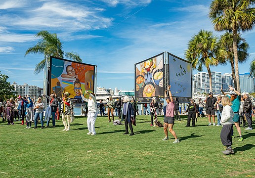 Attendees celebrate the opening of "Embracing Our Differences" at the 2024 exhibition.