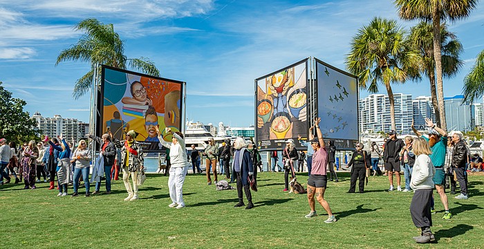 Attendees celebrate the opening of "Embracing Our Differences" at the 2024 exhibition.