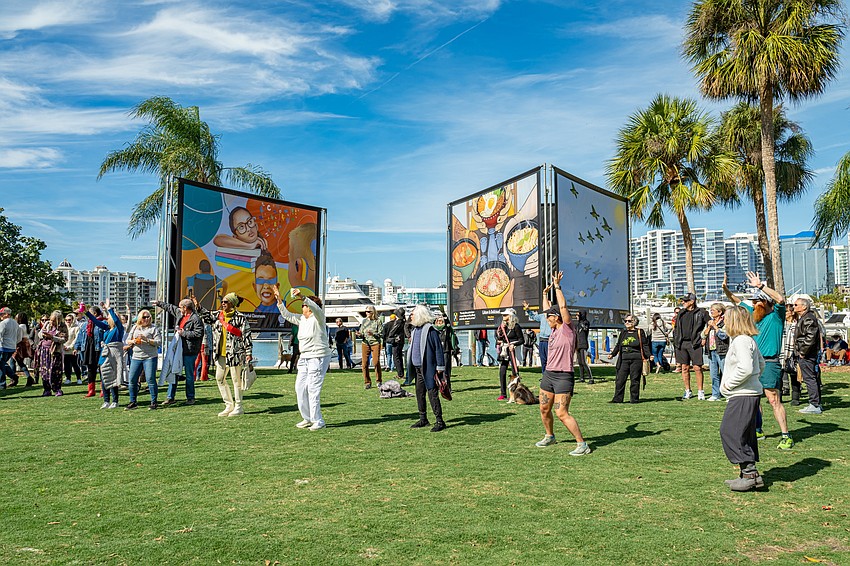 Attendees celebrate the opening of Attendees celebrate the opening of