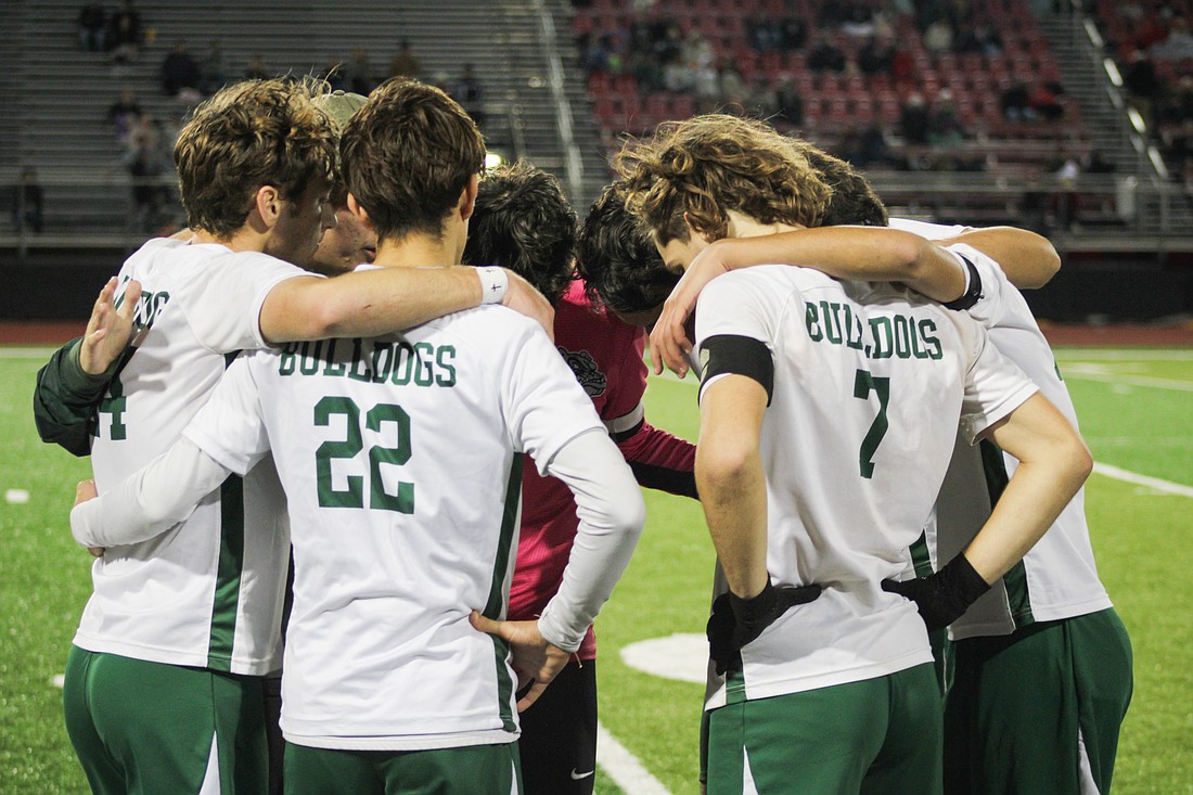 Flagler Palm Coast players huddle up before the penalty-kick period at New Smyrna Beach. Courtesy photo