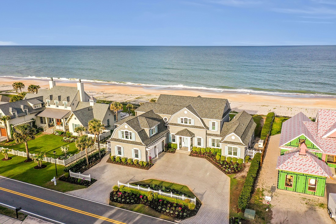 Oceanfront two-story home features six bedrooms, five full and one half-bathrooms, patio, porches, pool, dune walkover and two-car garage.