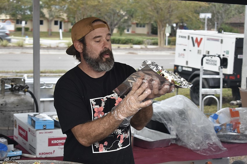 Garrett Springer prepares to serve a gryo.