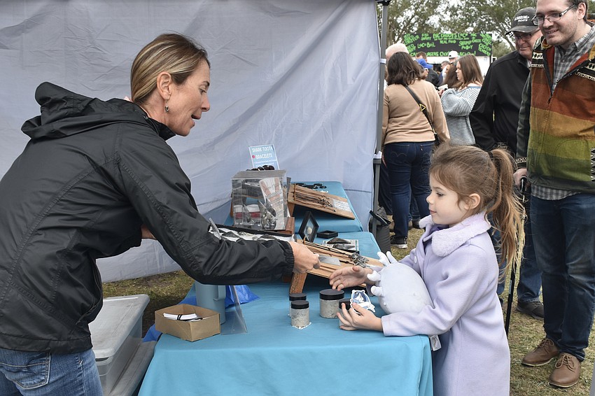 Stacey Anderson of Sunken Hunter makes a sale to Juliana Jacobs, 6.