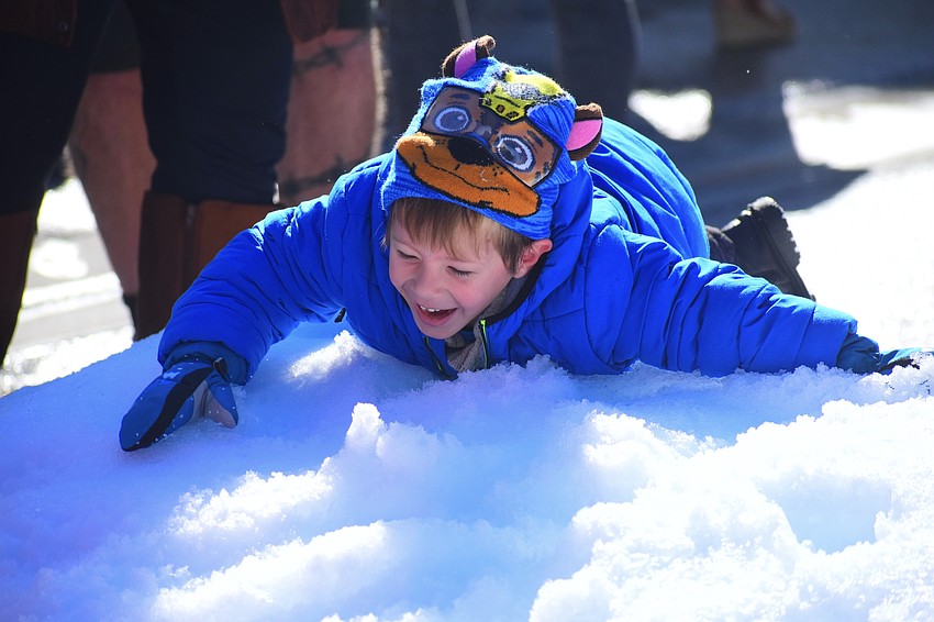 Olin Croce, 3, enters the snow for the first time.
